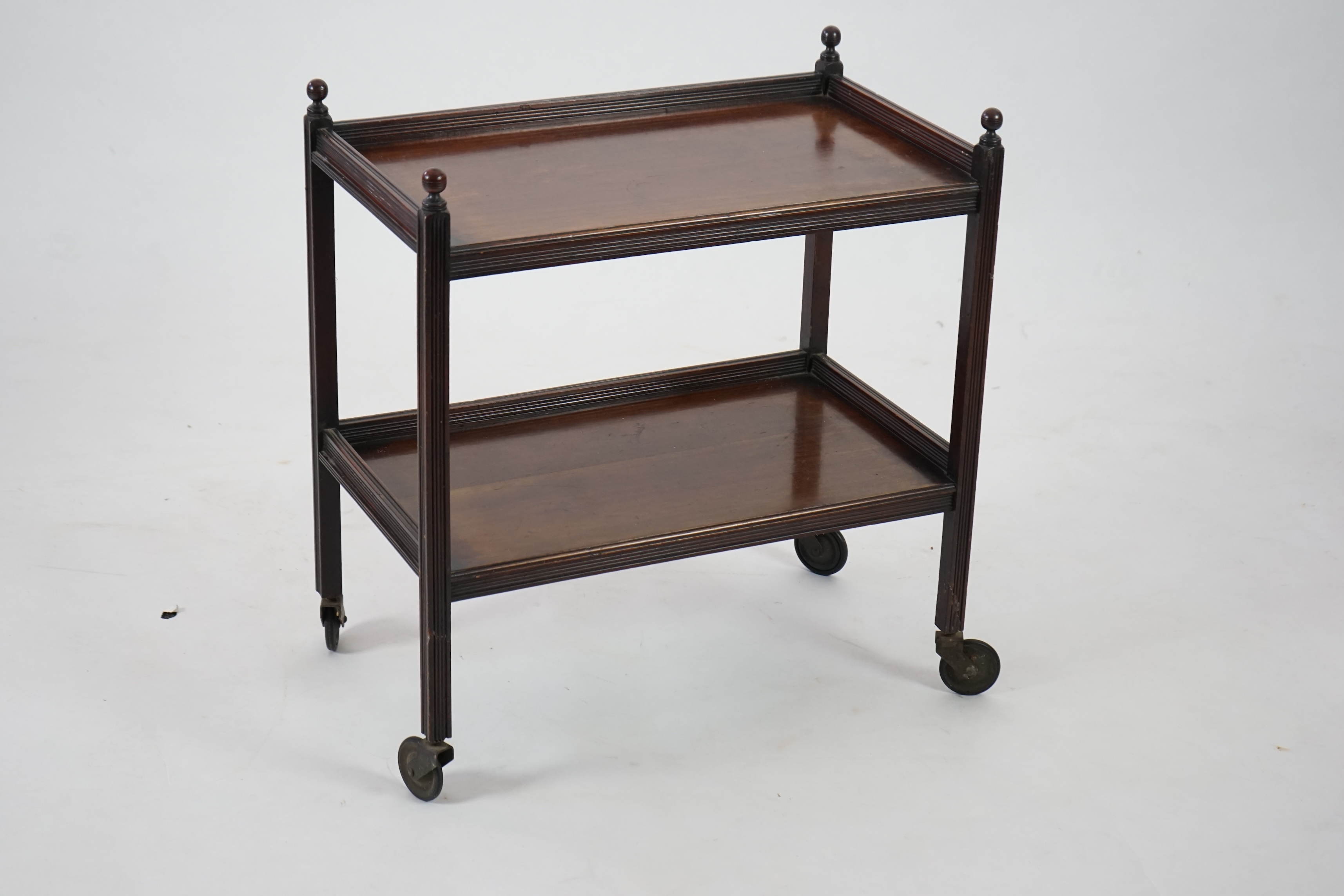 An Edwardian mahogany two tier trolley